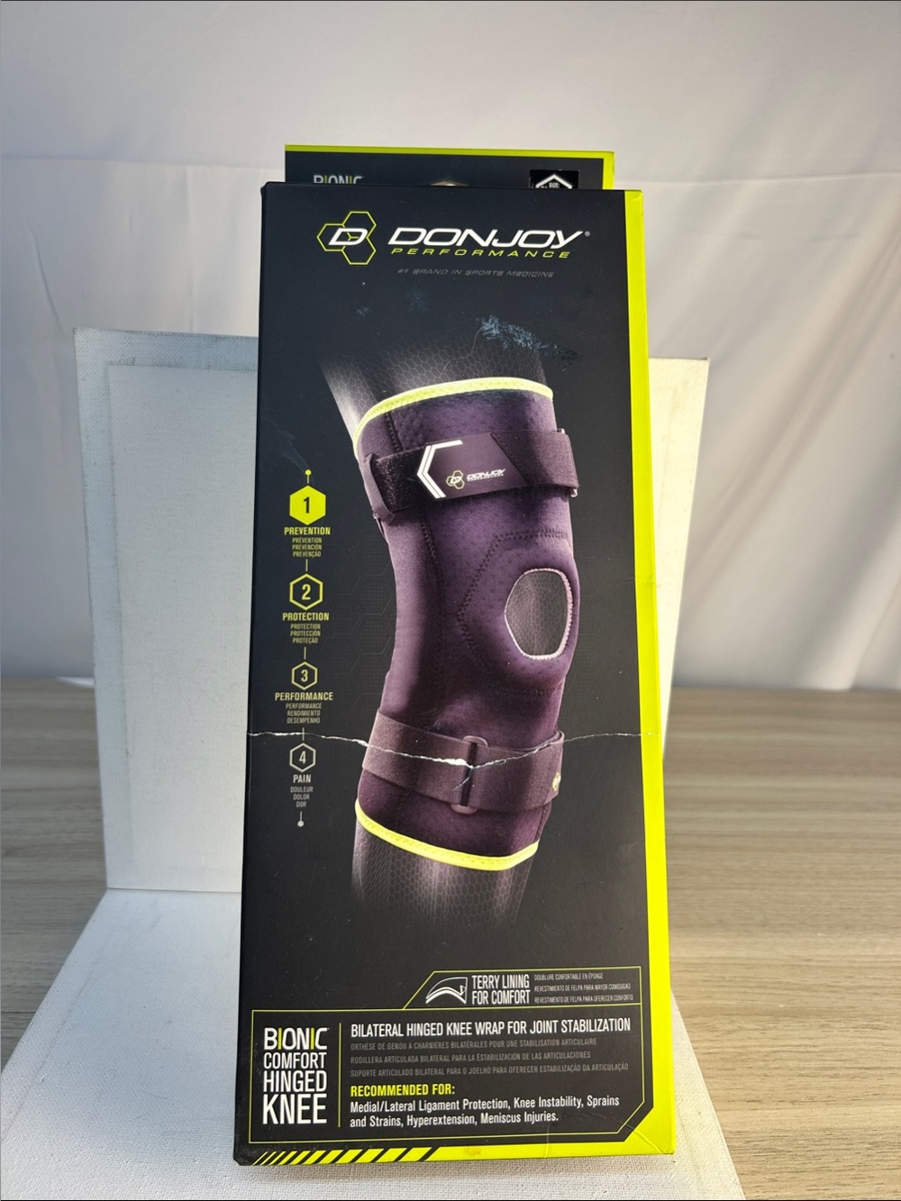DonJoy Bionic Comfort Hinged Knee Brace in Black with Neon Yellow Trim
